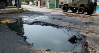 Habrá presupuesto para reparar baches para ciudades: AMLO