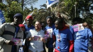 Migrantes haitianos en el cierre de precampaña de Taboada